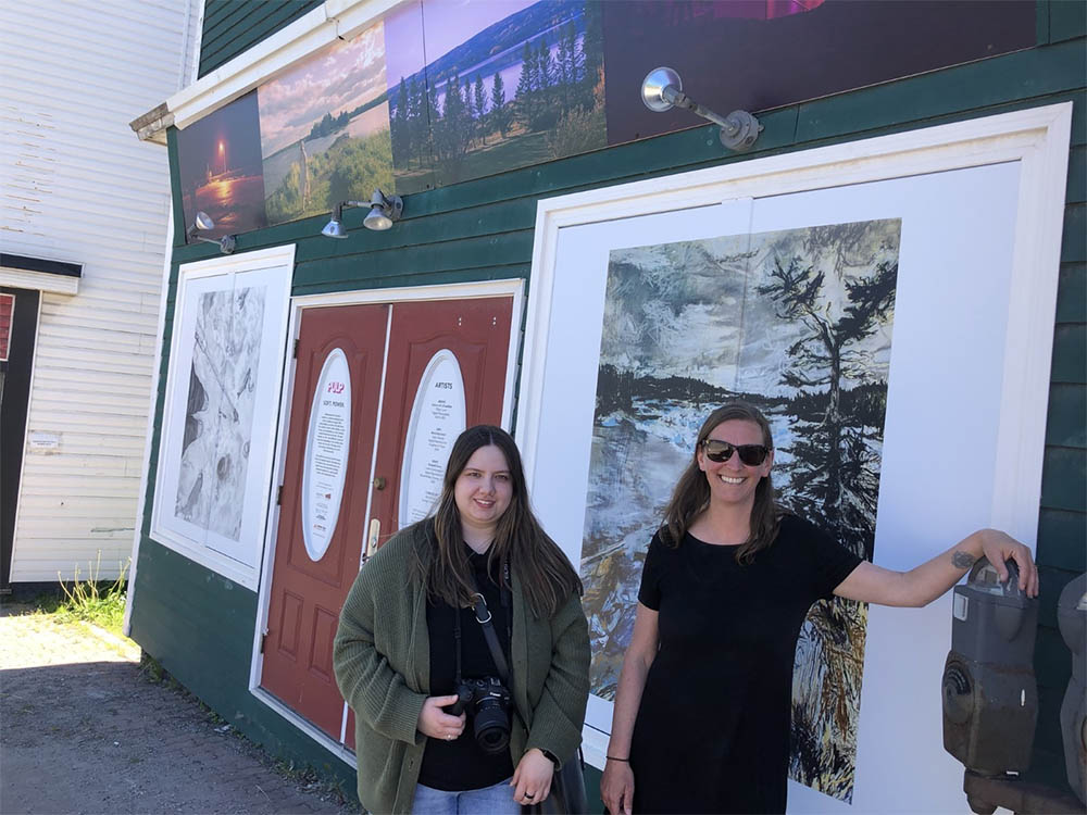 Emily Anderson and Alli Johnston outside the PULP installation on Broadway.