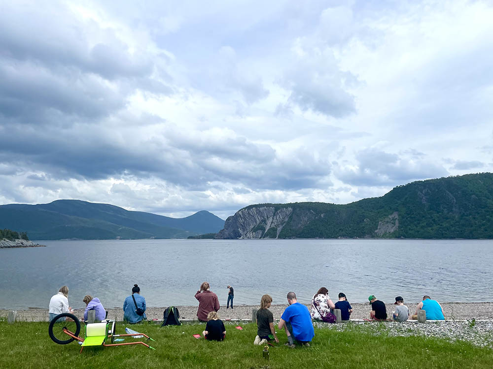 Passersby in Norris Point, Fros Morne National Park, stop in to see what's going on.