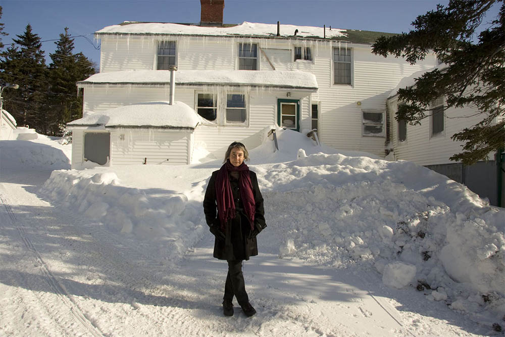 Caption: Joan Cranston of Bonne Bay Consulting, outside the Bonne Bay Cottage Hospital, where many of the GNP-RC activities in Norris Point take place.